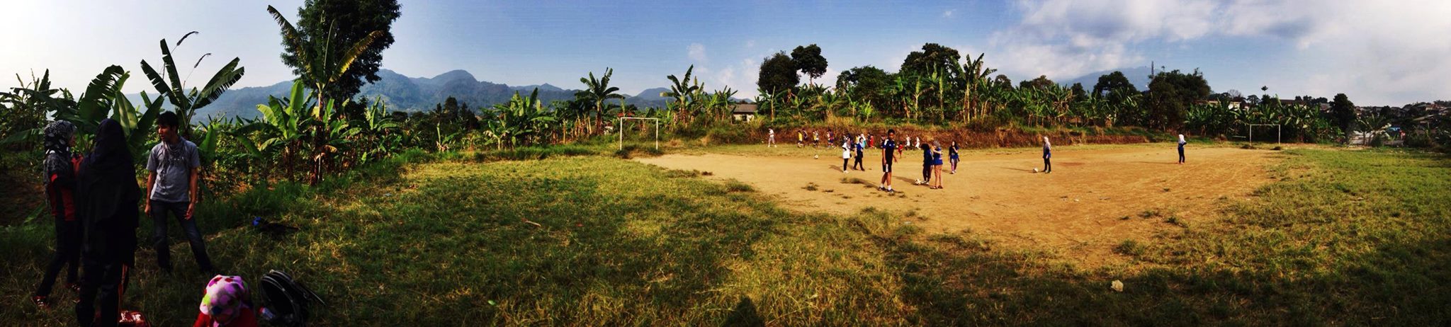 Refugee children play soccer on an outdoor pitch in West Java - Credit: Thomas Brown.